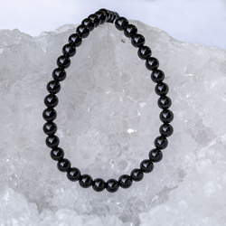 KN-RS-10,0 ONBL Natural stone - round smooth - ONYX BLACK - strand